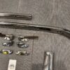 1958 Chevy Impala Convertible Inner Windshield Trim + Visor Brackets and Top Striker Plate