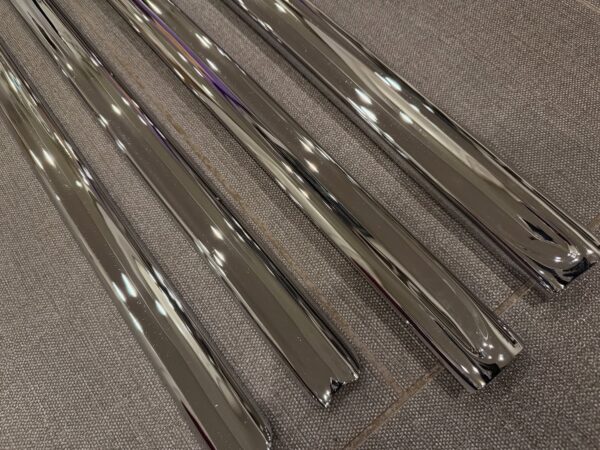 1955 Chevy 2-Door Nomad Side Moldings – OEM Restored (4-Piece Set)