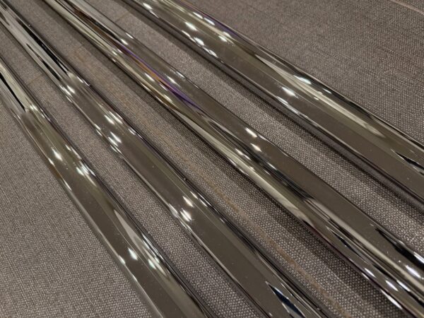 1955 Chevy 2-Door Nomad Side Moldings – OEM Restored (4-Piece Set)