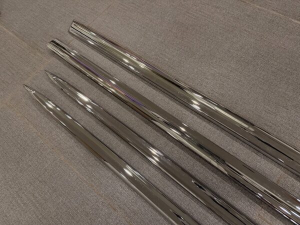 1955 Chevy 2-Door Nomad Side Moldings – OEM Restored (4-Piece Set)